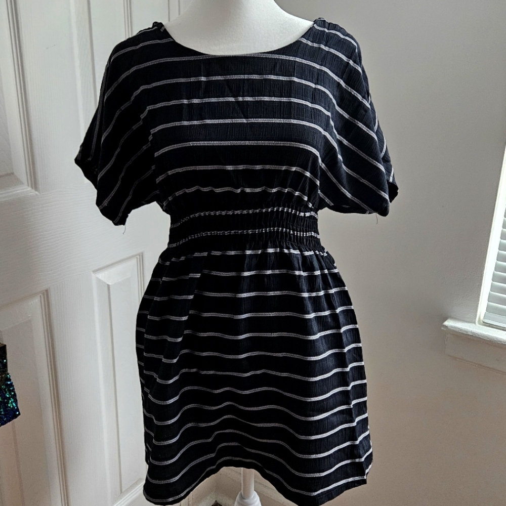 Striped black mini dress. Open back. Wide arms. Size small.